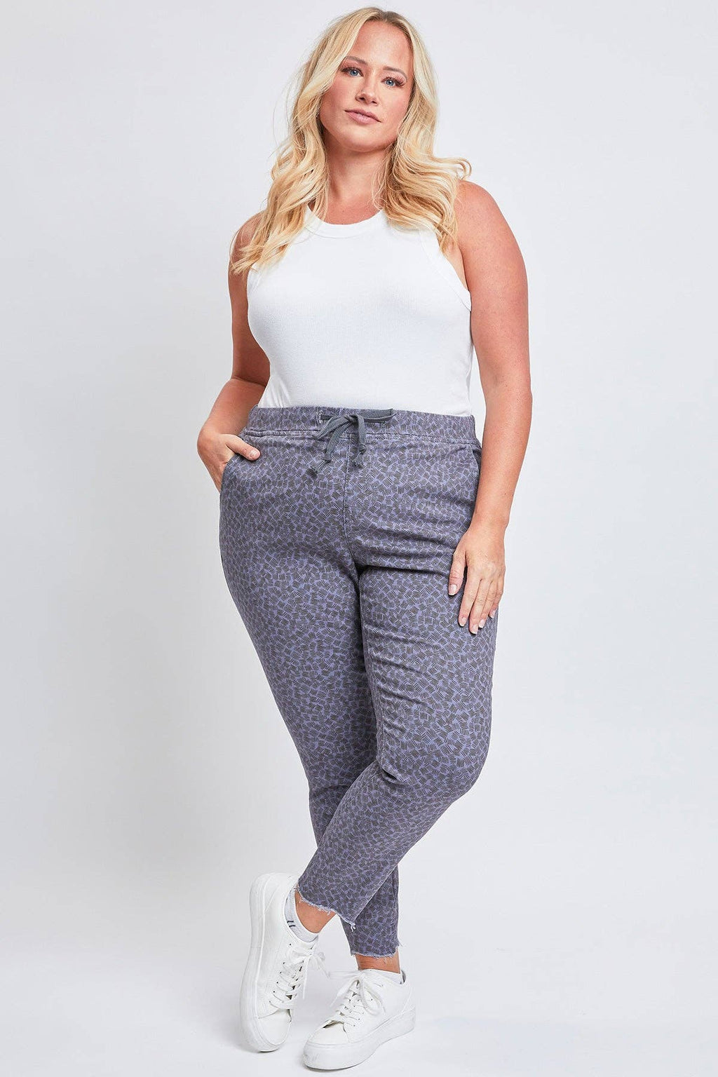 Plus Size Pull On Denim Joggers with a Whiskering Design and a Dog Bite Hem