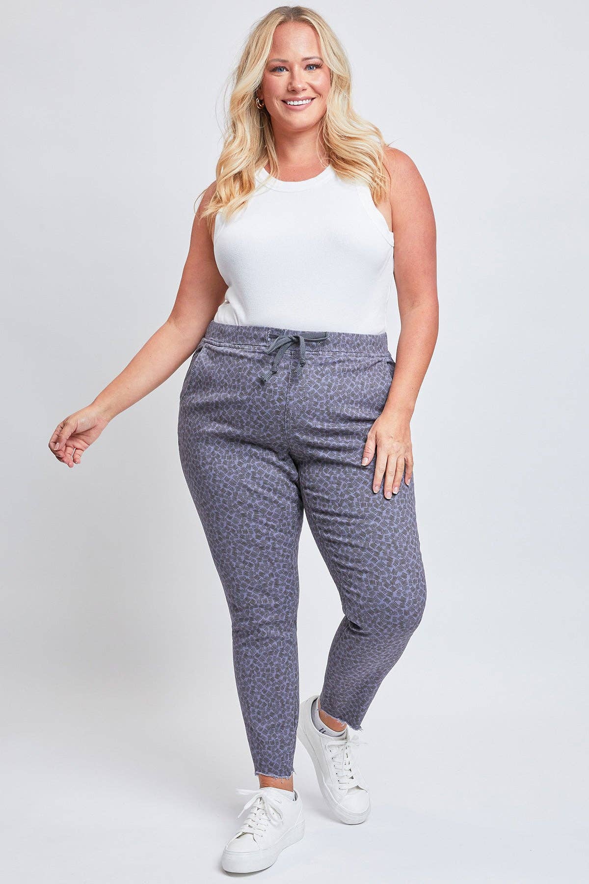 Plus Size Pull On Denim Joggers with a Whiskering Design and a Dog Bite Hem